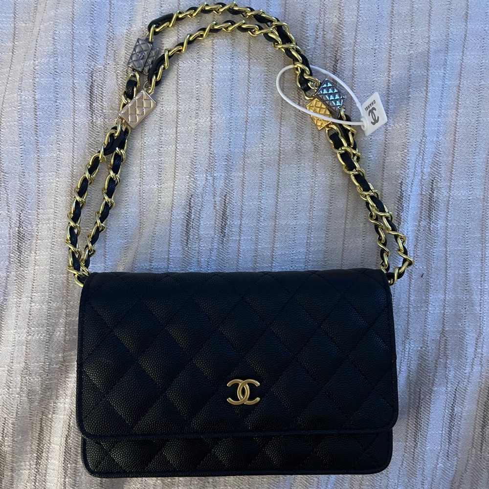 Small Black Chanel Classic Handbag with gold accents
